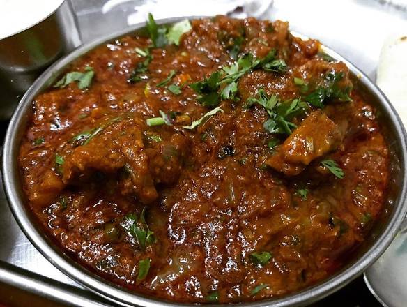 Tender chunks of succulent lamb bathed in a luxurious blend of aromatic spices and creamy sauce, inviting a culinary journey filled with warmth and flavor in every delectable bite of lamb curry